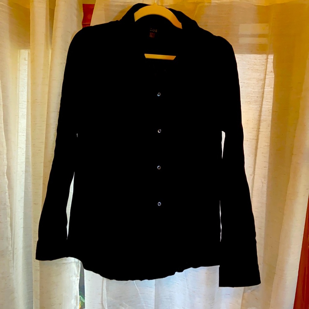 Black long sleeve cotton blend button down with collar.